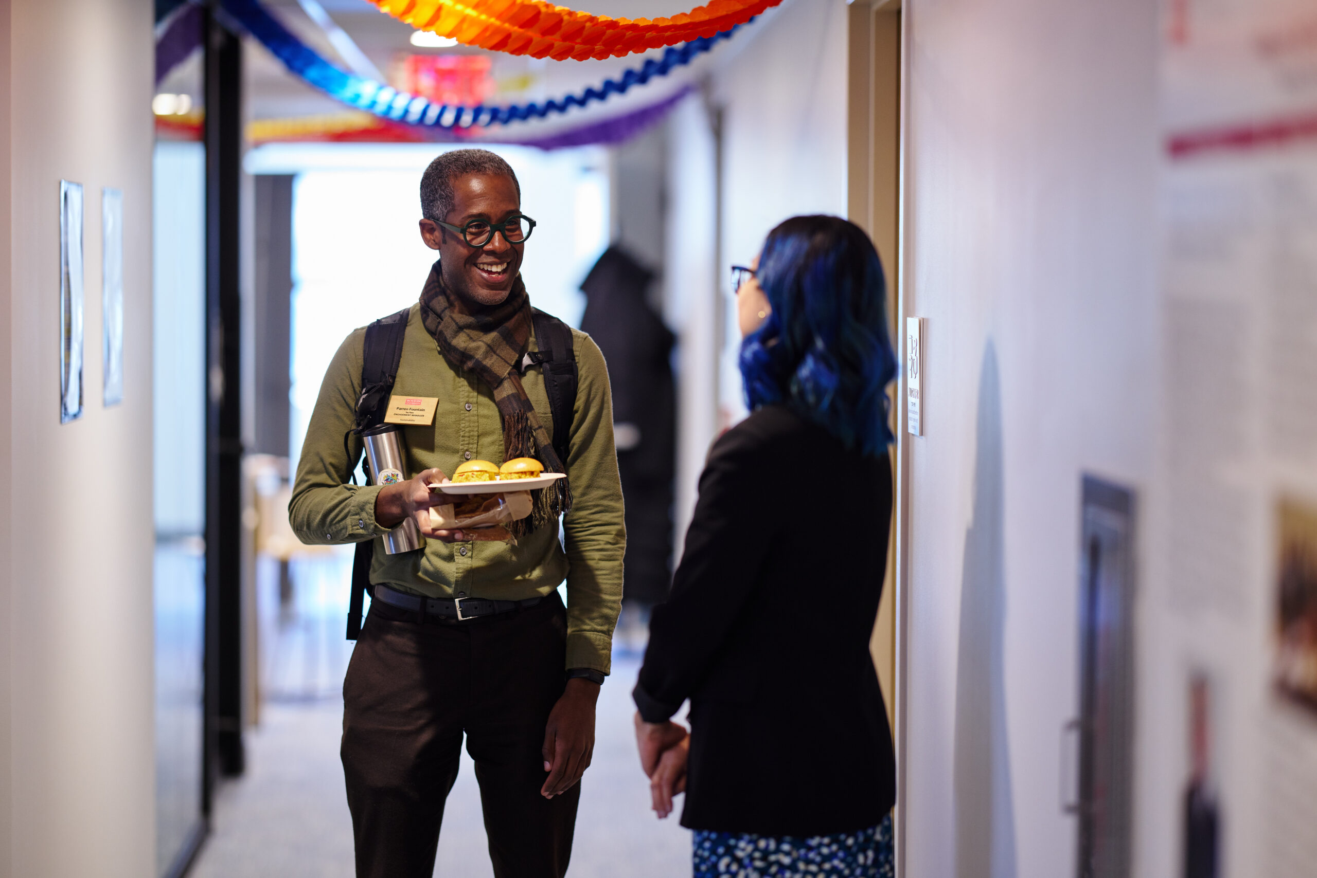BU staff conversing during the grand opening of BU Diversity & 包容
