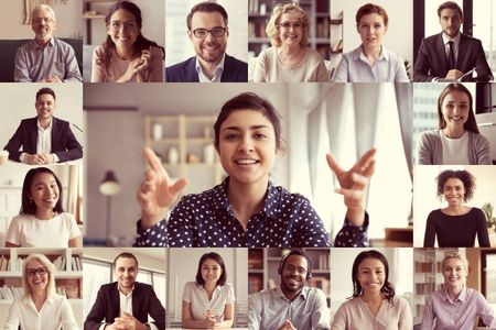 Diverse group of professionals smiling during a Zoom meeting