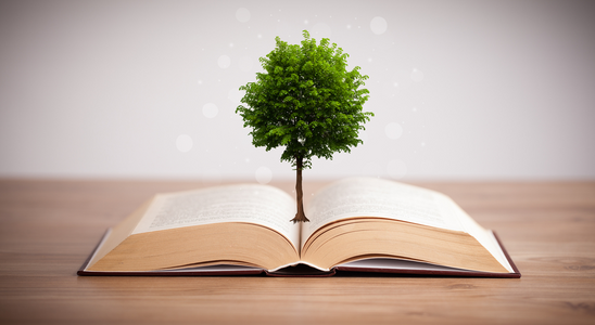 Tree growing out of open book