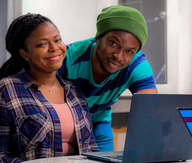 Two black people in front a computer