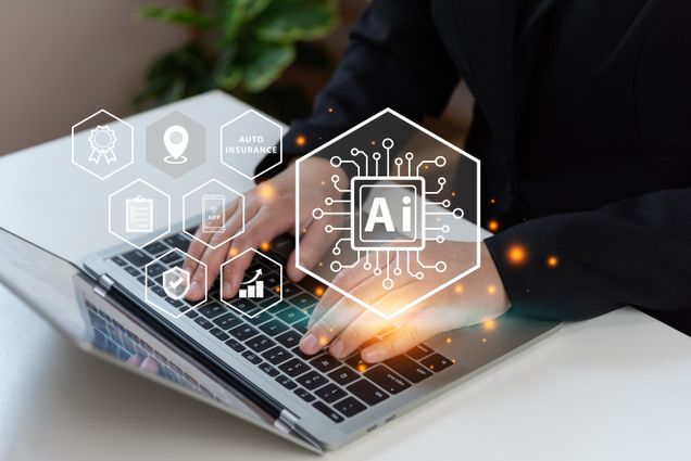 Businessman Using a Laptop With AI Icons floating over the keyboard
