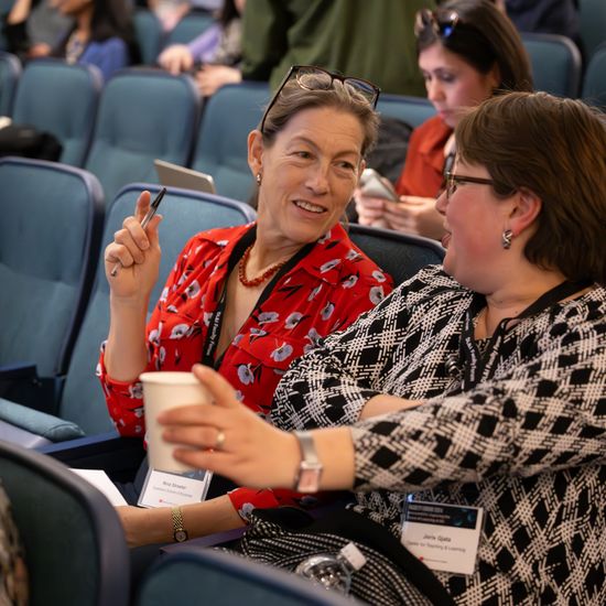 Joris Gjata of CTL speaks with an audience member before the Keynote