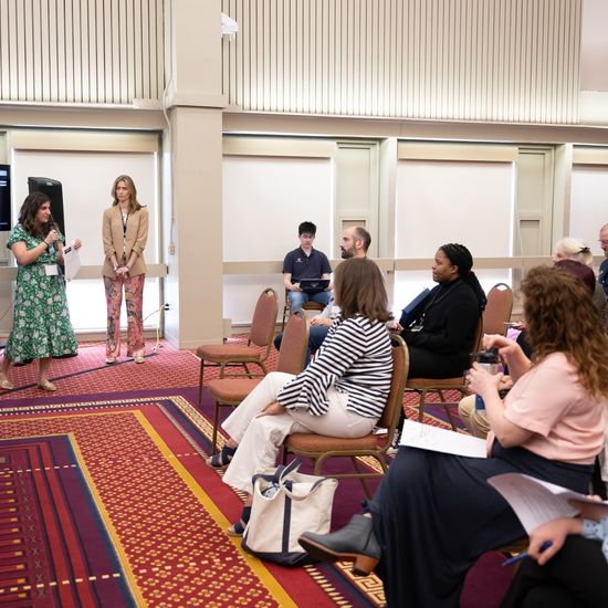 The audience is listening to a presentation during one of the breakout sessions.
