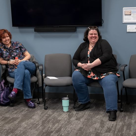 Romy Ruukel and an attendee are seated during the Faculty Forum.