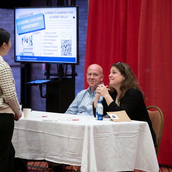 An attendee visits an e-poster session.