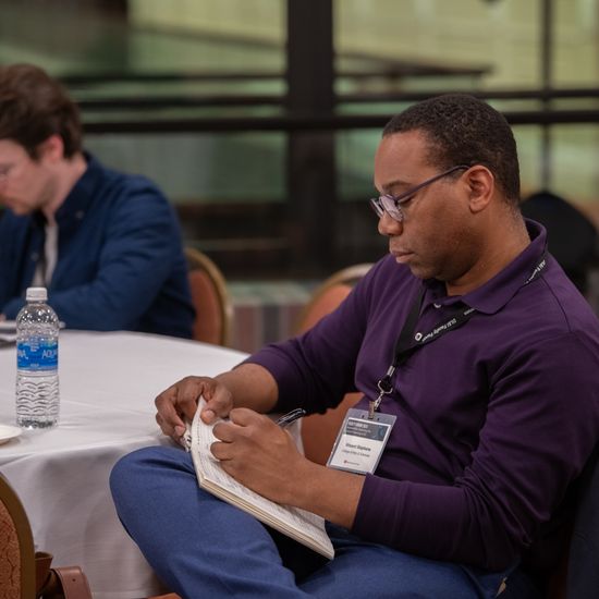 Attendees are taking notes during breakout sessions.