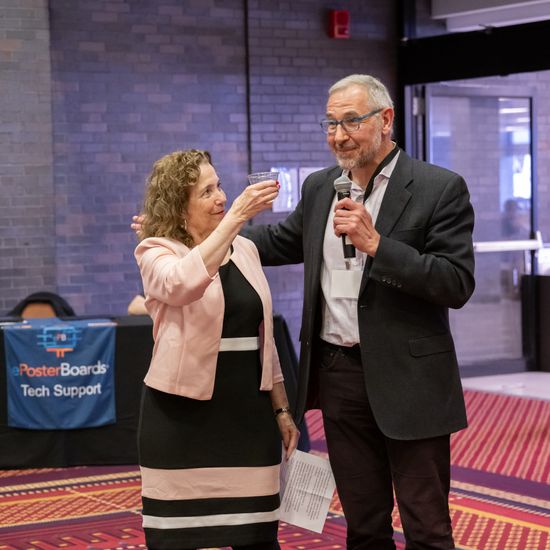 Karen Jacobs toasts Chris Dellarocas at the end of his DL&I tenure.