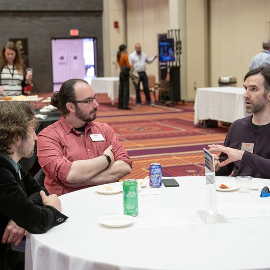 Attendees chat amongst themselves during the reception.
