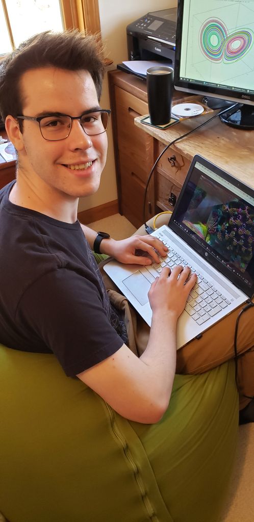 A photo of Kevin Reiss working at his computer at home