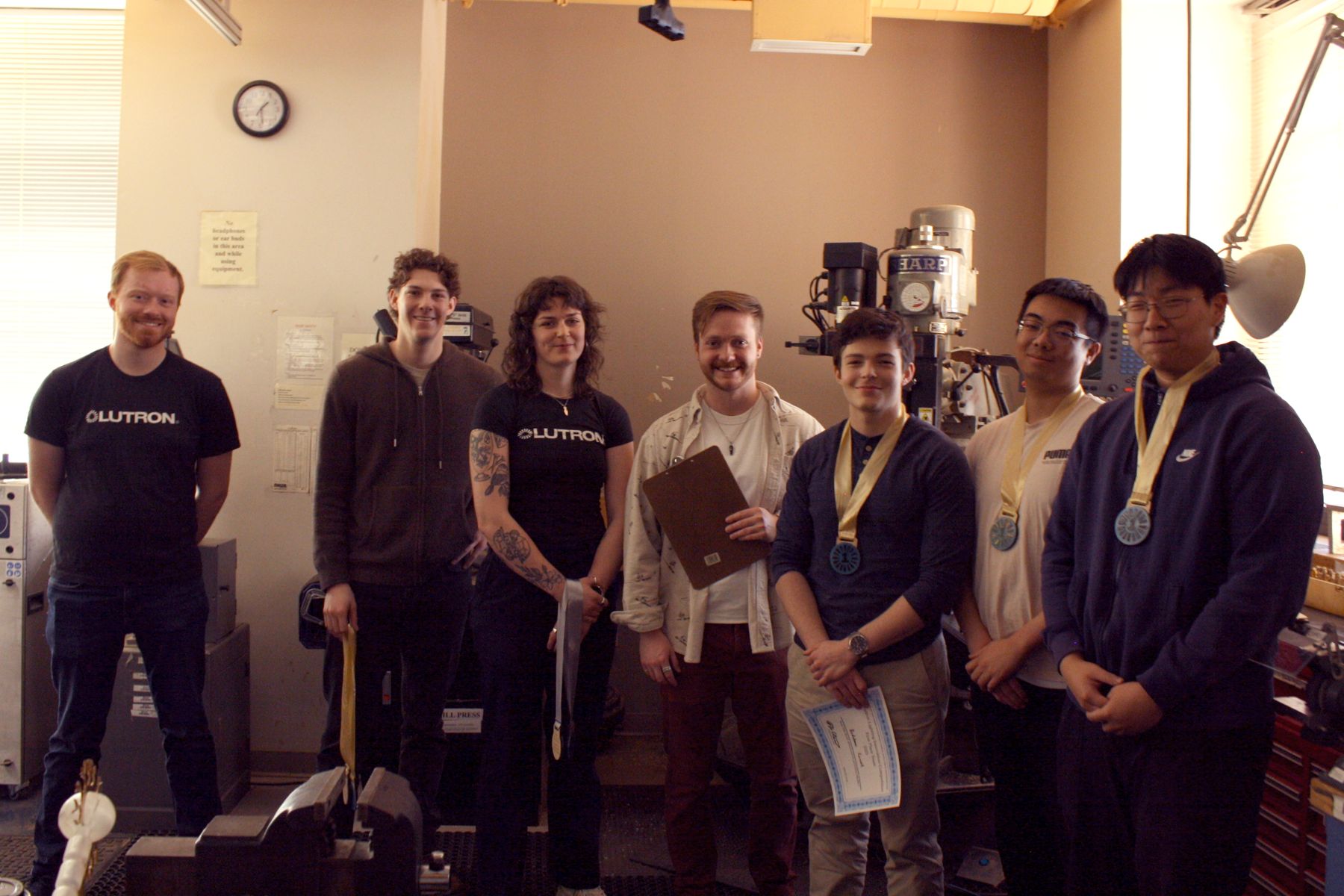 3 of the minecraft lamp team members with the lutron judges and their 1st place medals