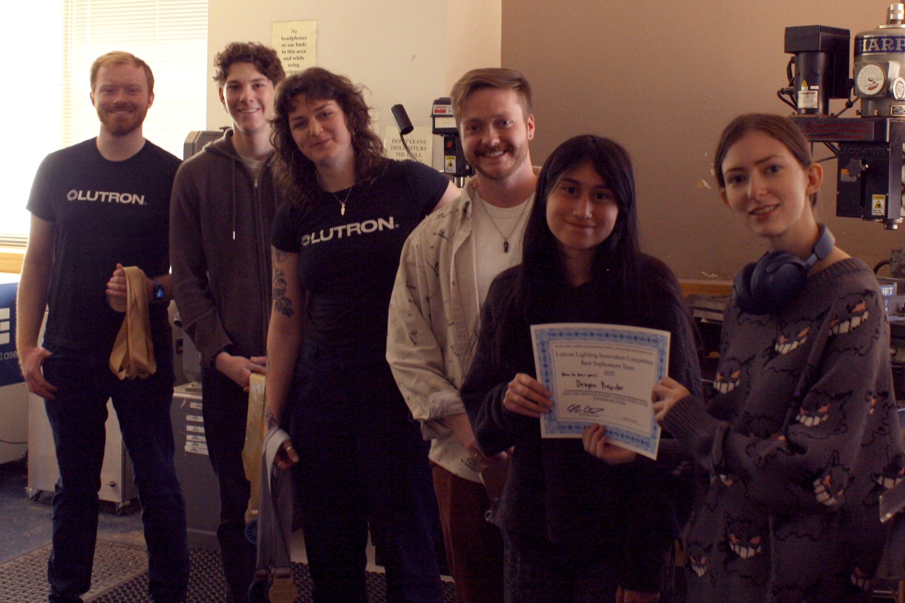 the 2 students behind the dragon projector project with the lutron judges and their best sophomore project certificate