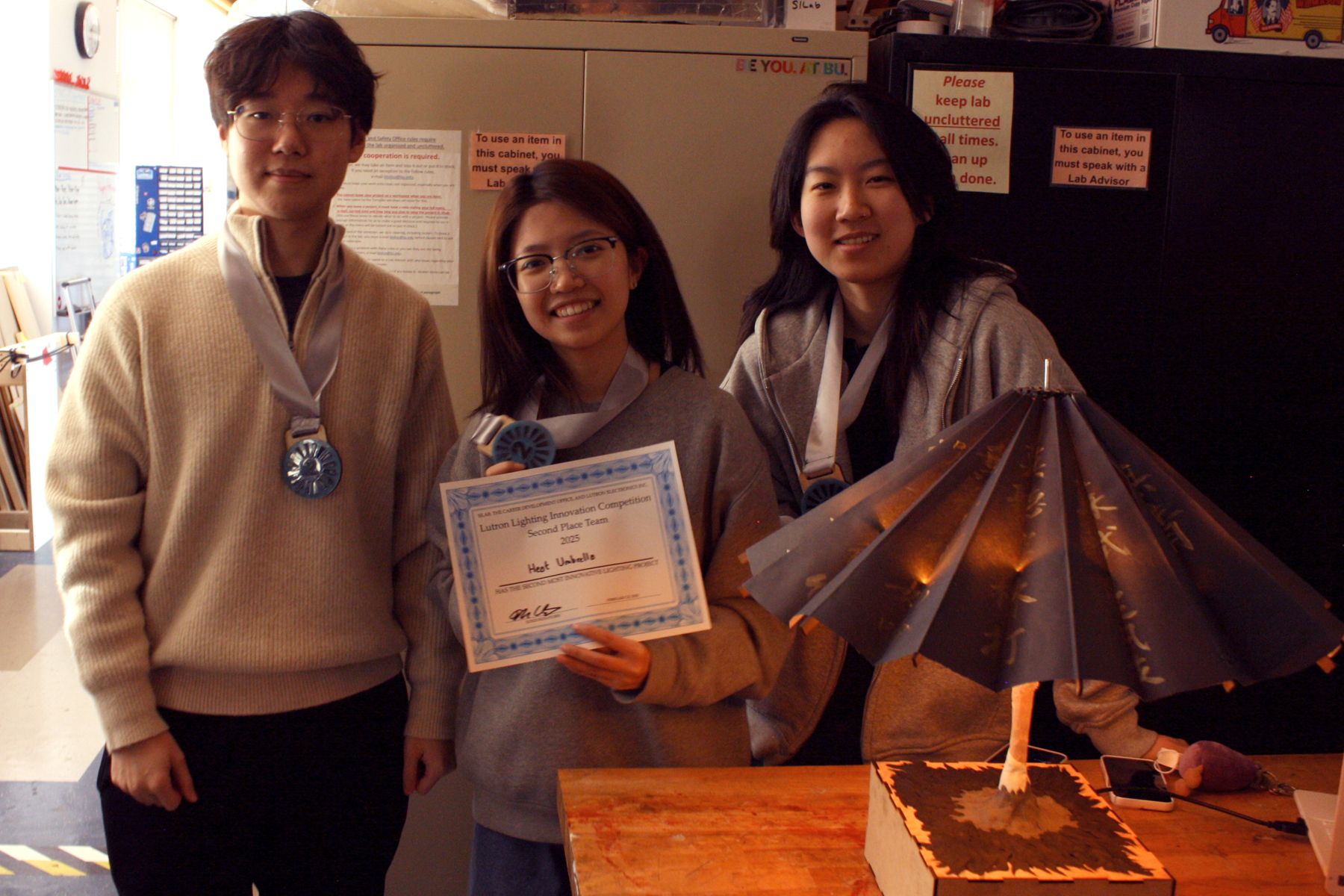 the umbrella team with their project and their 2nd place medals
