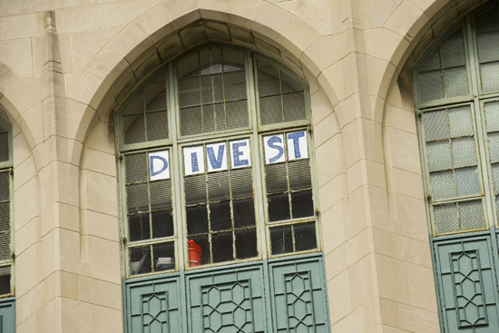 Divest sign, Stone Science Building Divest sign, Nathan Phillips professor of earth and environment, Boston University, Divest BU, Boston University student groups organizations, college and university campus fossil fuel divestment movement, divest university endowments from fossil fuel investments, climate change action