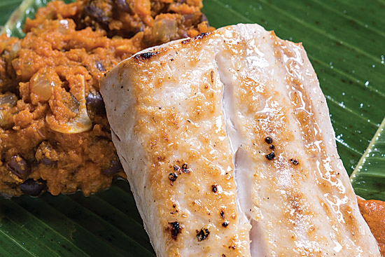 Broiled Mahi Mahi with Spiced Squash Puree and Maria's Mole, a dish included in Pollinger's new cookbook. Download the recipe here. Photo by Noah Fecks