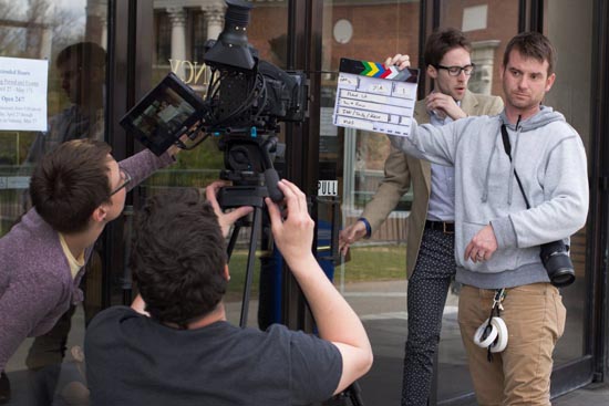Padrick Ritch (with clapboard), production supervisor at Harvard University’s Hauser Studio, shooting a film with colleagues (including Lauren Scully ’14, left) for the 2014 Boston 48 Hour Film Project. In addition to his role at Harvard, Ritch teaches production classes at COM and is developing two independent films. Photo by Sam Westover