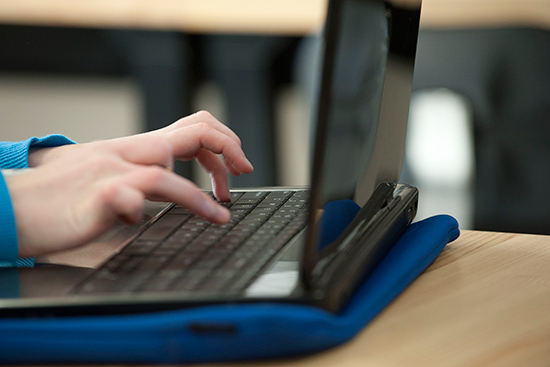 college student using laptop