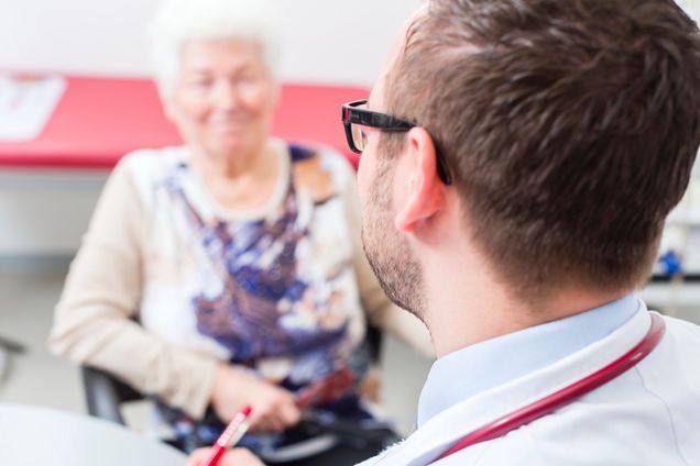 Doctor seeing senior patient in practice