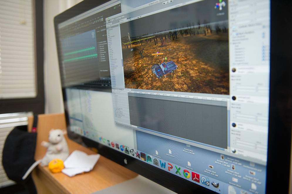 a computer workstation showing video game design work