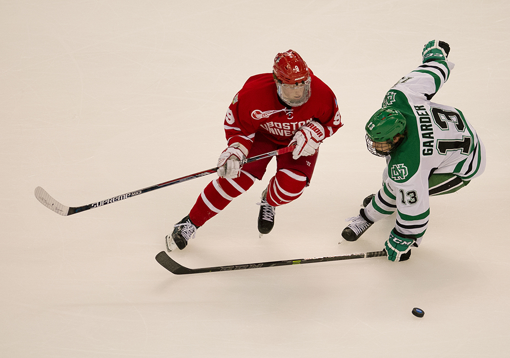 Jack Eichel (CGS'16) makes is way across the ice with North Dakota's Keaton Thompson on his heels during the second period of the 2015 Men's Frozen Four National Championships at TD Garden April 9, 2015. Photo by Jackie Ricciardi
