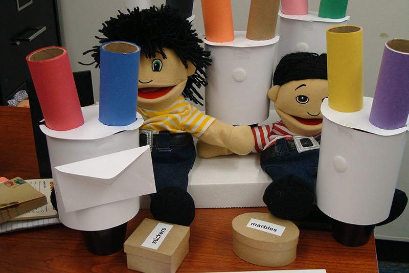 In a study at the Boston Museum of Science, Kathleen Corriveau had children drop a marble into one of two tubes to assess their preference for written or oral instructions to guide their actions.