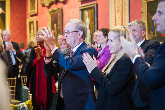 Trustees give a standing ovation to the announcement that the Campaign for BU has passed the $1 billion mark
