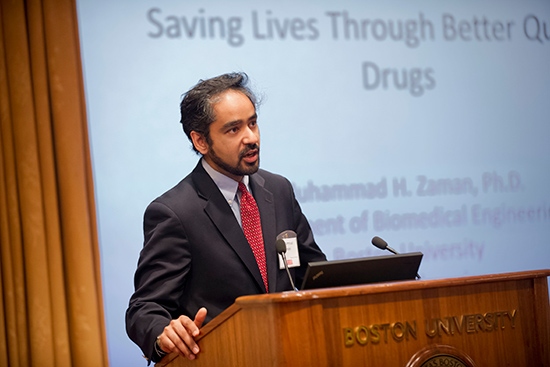 Muhammad Zaman standing in front of a podium