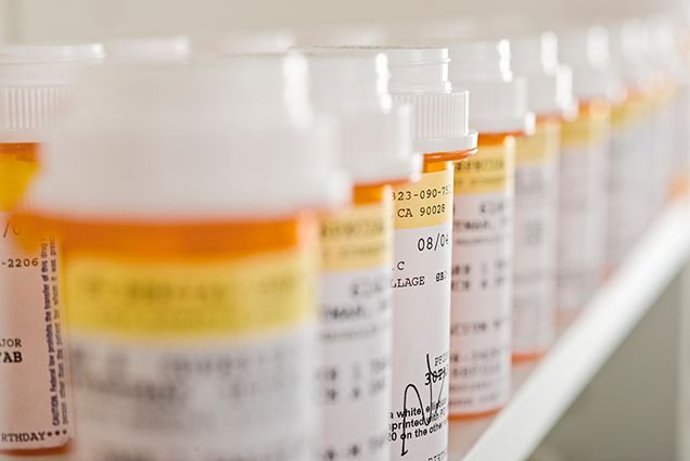prescription bottles on shelf