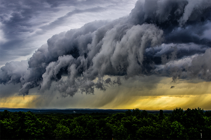 View of distant rain storm and storm clouds