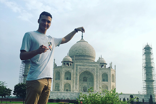 Kian McGee (SHA’18) stands in front of the Taj Mahal mausoleum in Agra, India