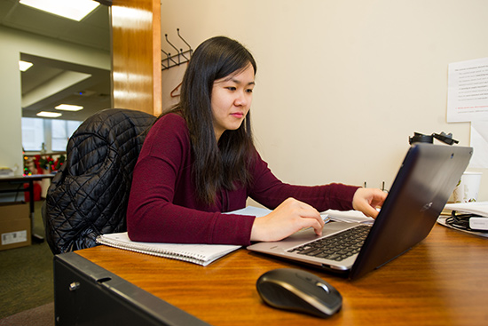 Rosy Chen (ENG’17) using a laptop