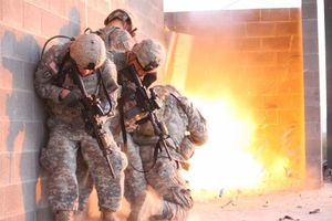 Officers of 1st Stryker Brigade Combat Team, Ready First 1st Armored Division, participate in an urban combat exercise at a training facility on Fort Bliss, Texas.