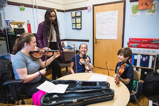 BU students with elementary school music students
