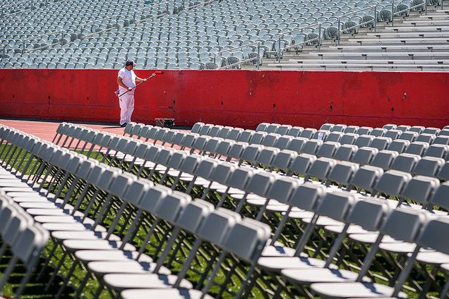 Freddy Franco of Wilder Painting refreshes the paint on Nickerson Field