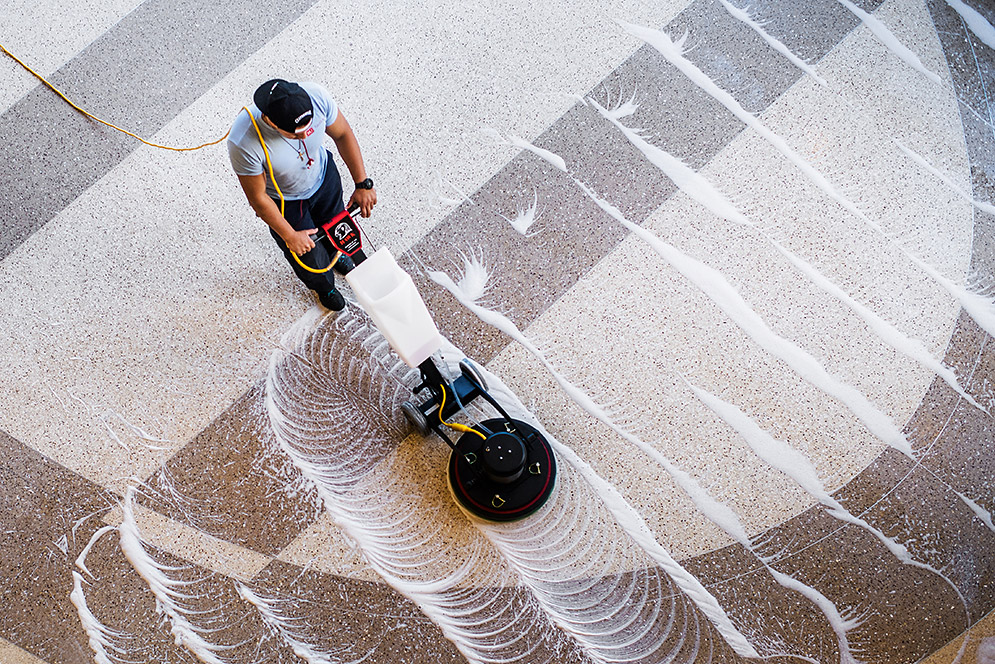 Rene Perez cleaning floor with machine