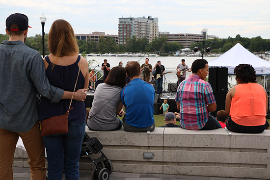 audience listening to band perform outdoors