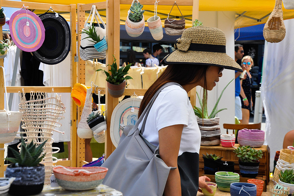 Young woman perusing Sowa Open Market