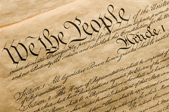 Top of the United States Constitution document showing the words "We the People"