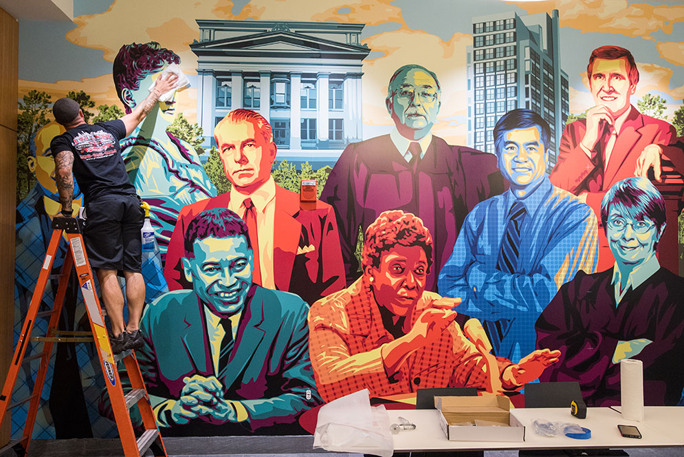 <em>Advancing Justice Since Day One,</em> a mural depicting 11 distinguished School of Law alums