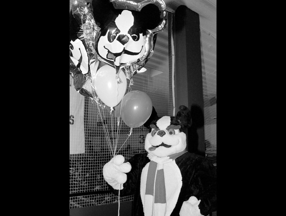 Rhett the Terrier, BU mascot, holds balloons during his annual birthday celebration in 1988.