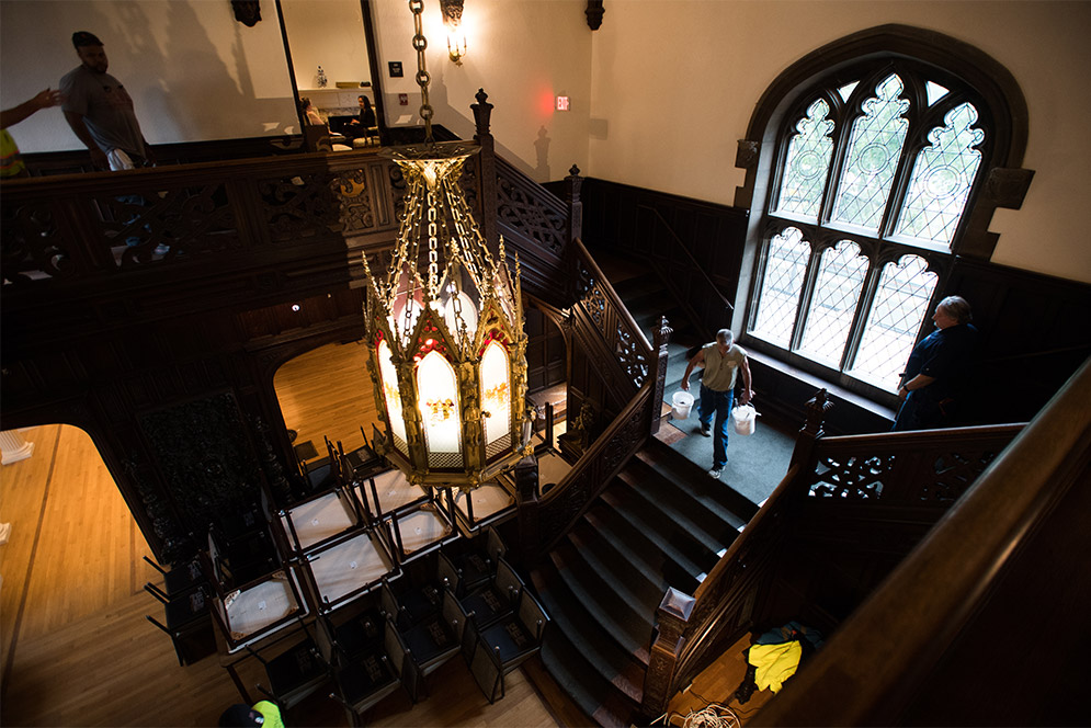 A view from the top looking down the grand staircase in the foyer of the Dahod Family Alumni Center at Boston University