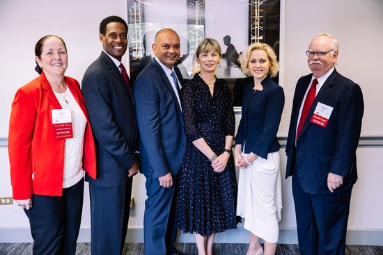 Young Alumni Award recipients pose with President Brown for a photograph