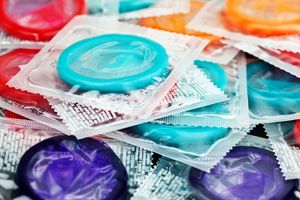 a pile of multicolored condoms