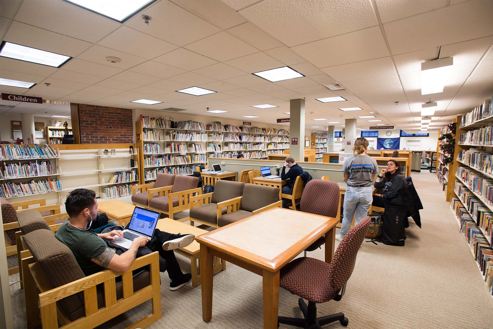 Students read and talk at the Pickering Educational Resources Library at Boston University.
