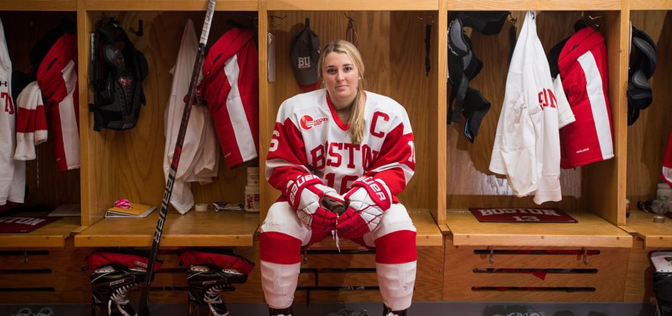 Sammy Davis wears her hockey uniform in the locker room