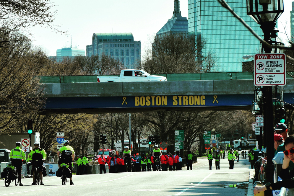 police officers patrolling at kenmore square near the finish line of the boston marathon
