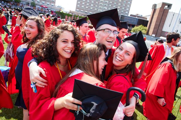 Jessica Baron, Sharon Sethna, John Mulligan, and Vika Lovell all hug after the 2019 Boston University Commencement on Nickerson Field on May 19, 2019.