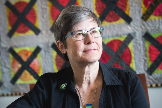 portrait of Julie Sandell looking off into the distance
