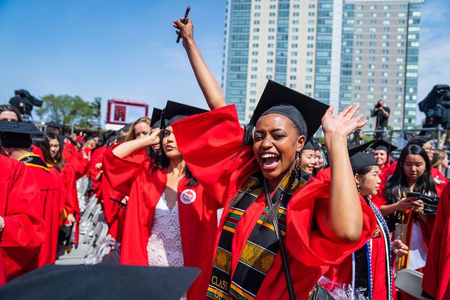 A graduate of the Boston University Class of 2019 celebrates after graduating at the 146th All University Commencement.
