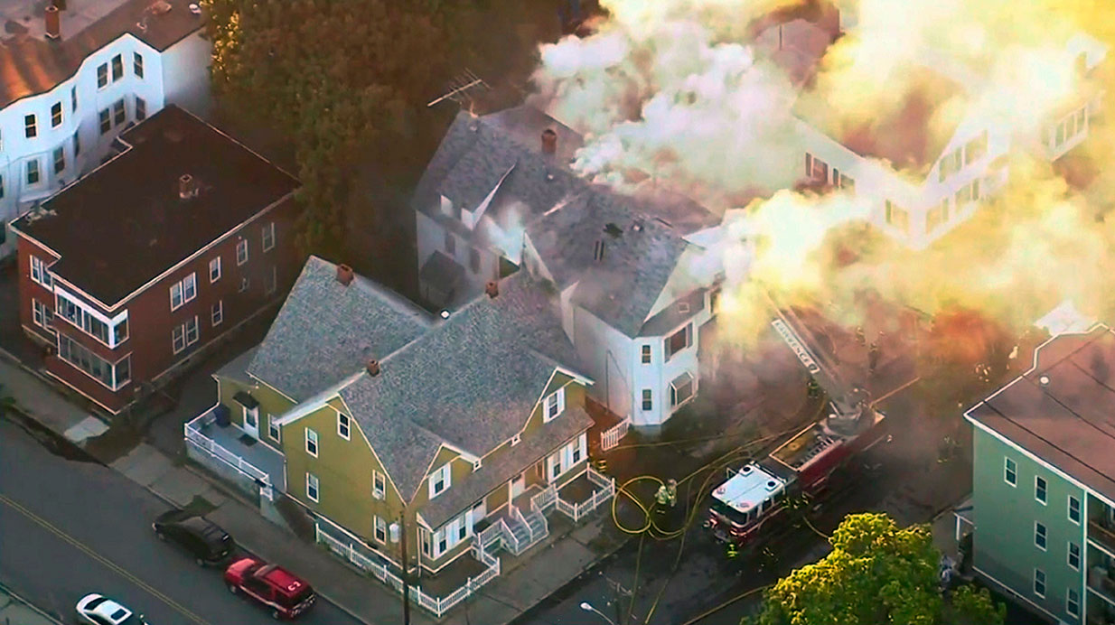 Firefighters battle a blaze in Lawrence, Mass., in September 2018 after overpressurized gas lines exploded in the city and in neighboring Andover and North Andover.