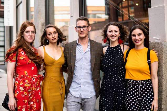 Adam Adelson poses with his fellow friends and artists at his gallery exhibition